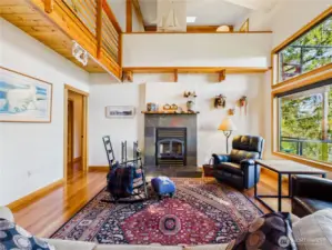 Upstairs on the main level. You can see the mezzanine level here. The fireplace is a wood fireplace