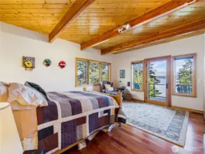 Primary bedroom that see water views from breakfast in bed