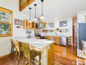 Beautiful kitchen for the chefs. This is a two-butt kitchen - room for multiple chefs. ON the right is a lowered pastry countertop with a marble top perfect for your pastry chef.
