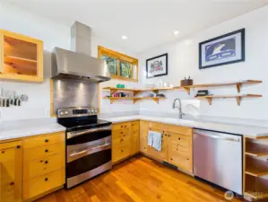 Kitchen has it all. Corian countertops with integrated kitchen sink. You're on public water so no worries about hard water.