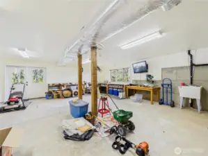 Workshop in the finished basement. Easy for a workshop or gym.