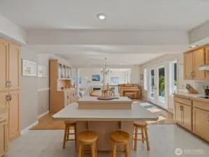 Large open Kitchen with center island, solid cabinets & lots of storage, new stainless steel appliances, subway tiles & fresh paint - overlooks the large Deck & Backyard.