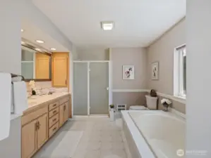 Primary Bath with dual vanities, large soaking tub, & shower.