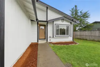 Freshly painted and thoughtfully restored exterior, complemented by a new front door entry.