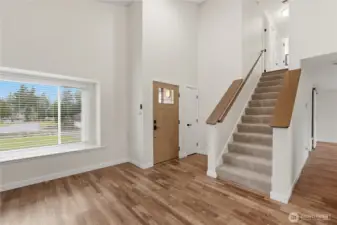 Timeless LVP flooring flows through the main level living area. All 3 bedrooms upstairs.