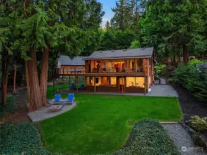 A quintessential Northwest cedar home nestled amidst lush surroundings, dedicated to fostering a sense of calm and peacefulness.