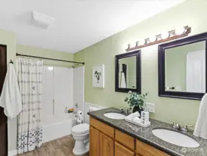 hall bathroom with dual vanity