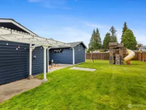 expansive backyard, patio, gate access, playset, and shed