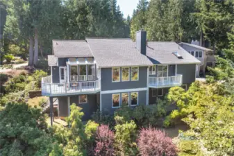 Unwind outdoors on your expansive decks with forest views and total tranquility—this backyard is pure Pacific Northwest living
