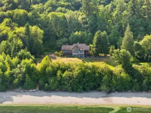 The house, the waterfront lot to the left of the home, and the 5 acres upland adjoining the home.   Notice the stairs to the beach.  The beach has been planted with oysters.