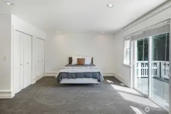 The primary suite features a private balcony, gas fireplace with new quartz slab facing, and an abundance of space.