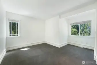 Second level bedroom #2 - several windows for natural light, ample space, and recently refreshed carpet.