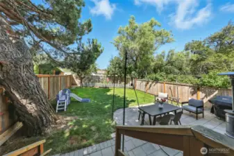 This yard is amazing! It is fully fenced, level, and features a large grass area, room for gardening plus an entertainment sized patio!