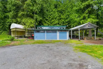 Exterior of the shop, and the covered RV parking with hookups!