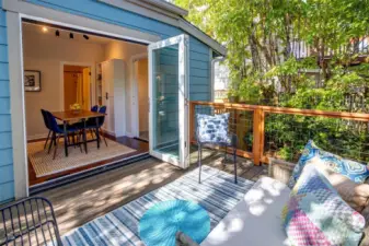Accordion doors open to private back deck.