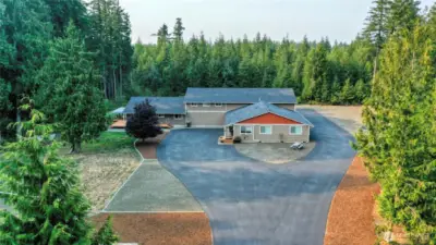 1158 SF 2 Bedroom Home & 1450 SF 2 Bedroom behind the tree on the left with the deck