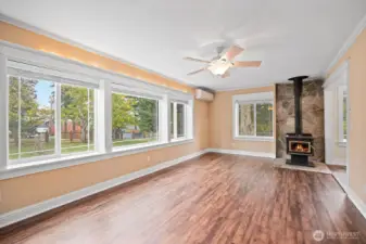 Living room with minisplit and wood stove