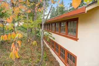 2 level barn, with storage above and stalls for chickens and goats below.