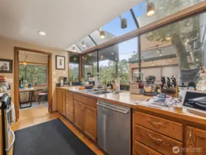An expansive garden window add to the beauty of this fantastic kitchen with the eating nook against the window