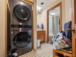 The laundry area is located in the second suite bathroom