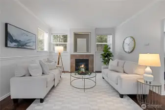 Bright living room featuring a cozy fireplace and abundant natural light