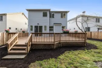 Large backyard deck ideal for gatherings and relaxation