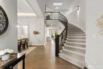 Impressive design to suit today's lifestyle!  Dramatic two story entry with stunning custom staircase and balusters.