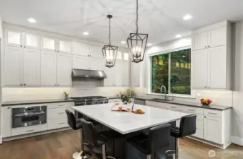 Stunning upgraded custom cabinetry.  Extended cabinet height with glass doors and accent lighting.  All cabinets and drawers have soft close feature.