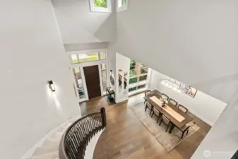 Upgraded staircase with custom handrail and metal balusters