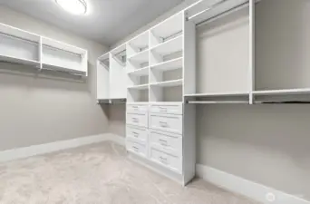Custom walk-in closet as part of the primary bedroom suite.