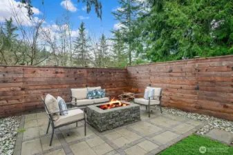 Patio with firepit in the private, fully fenced back yard. Please note: Lawn is photo shopped. Front and back lawn have been  re-seeded and fertililzed.