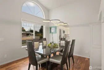 Vaulted ceilings and huge picture windows in the formal dining room.