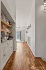 Custom coffee/breakfast bar built into the hallway leading to the kitchen.