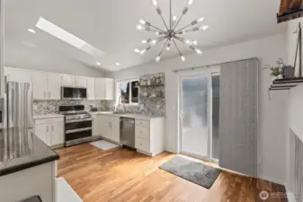 Beautifully updated kitchen with slider out to back deck.