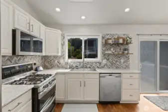 Fantastic gas range and window looking out to the back yard.