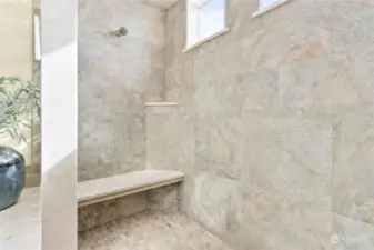 Primary bathroom upgraded with marble countertops, ceramic tile throughout with in-floor heating! Huge Walk-in shower!