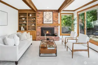 Signature Buchan custom built-ins with crown molding & beams. Walls of windows bring the outside in!