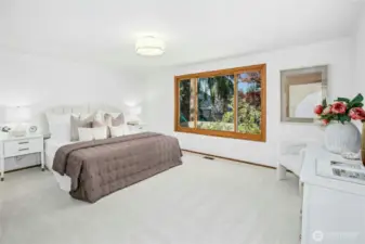 Spacious primary bedroom on the upper level. All NEW interior paint - April 2025. All NEW plush carpet - May -2025