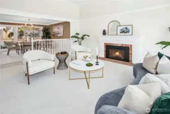 The formal living room features a vaulted ceiling with signature Buchan   crown molding & wainscotting
