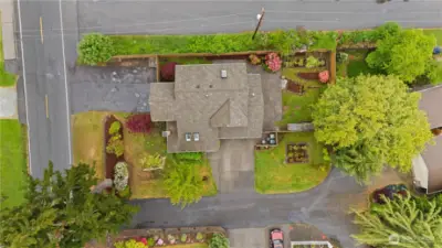 Aireal view of the home.  See driveway in front & on left see side driveway for RV parking.  Roof looks pretty amazing too.