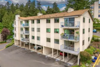 This unit includes covered parking located just below, along with a private storage room.