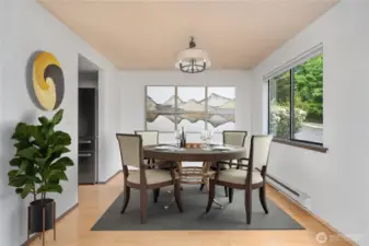 The dining area is accented with a window to let in the natural light. Virtually staged.