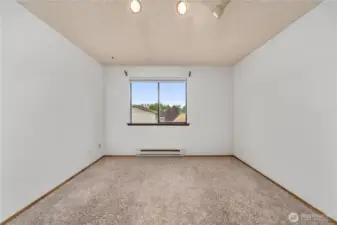 Another view of the primary bedroom.
