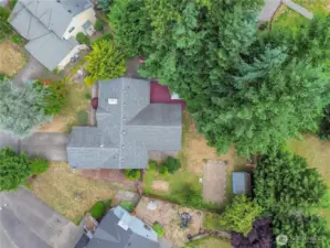 Drone view showcases the full layout of the property.  .29 acre, RV parking, shed, deck.  A perfect visual of how much space and potential this home truly offers.
