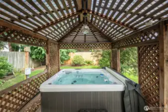 Hot tub with custom pavilion/bar area and lighting