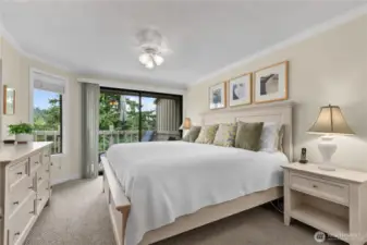 Primary bedroom with ensuite bath and slider to deck