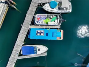 From above, the S.S. Guppy’s vibrant profile stands out in its secure Westlake slip, part of a friendly, gated marina on Lake Union.
