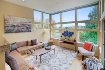 Light-filled living area with built-in sofa creates perfect conversation area.