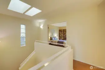Skylight creates a light-filled upper hallway.