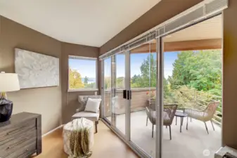 Primary bedroom suite with sliders to view deck.